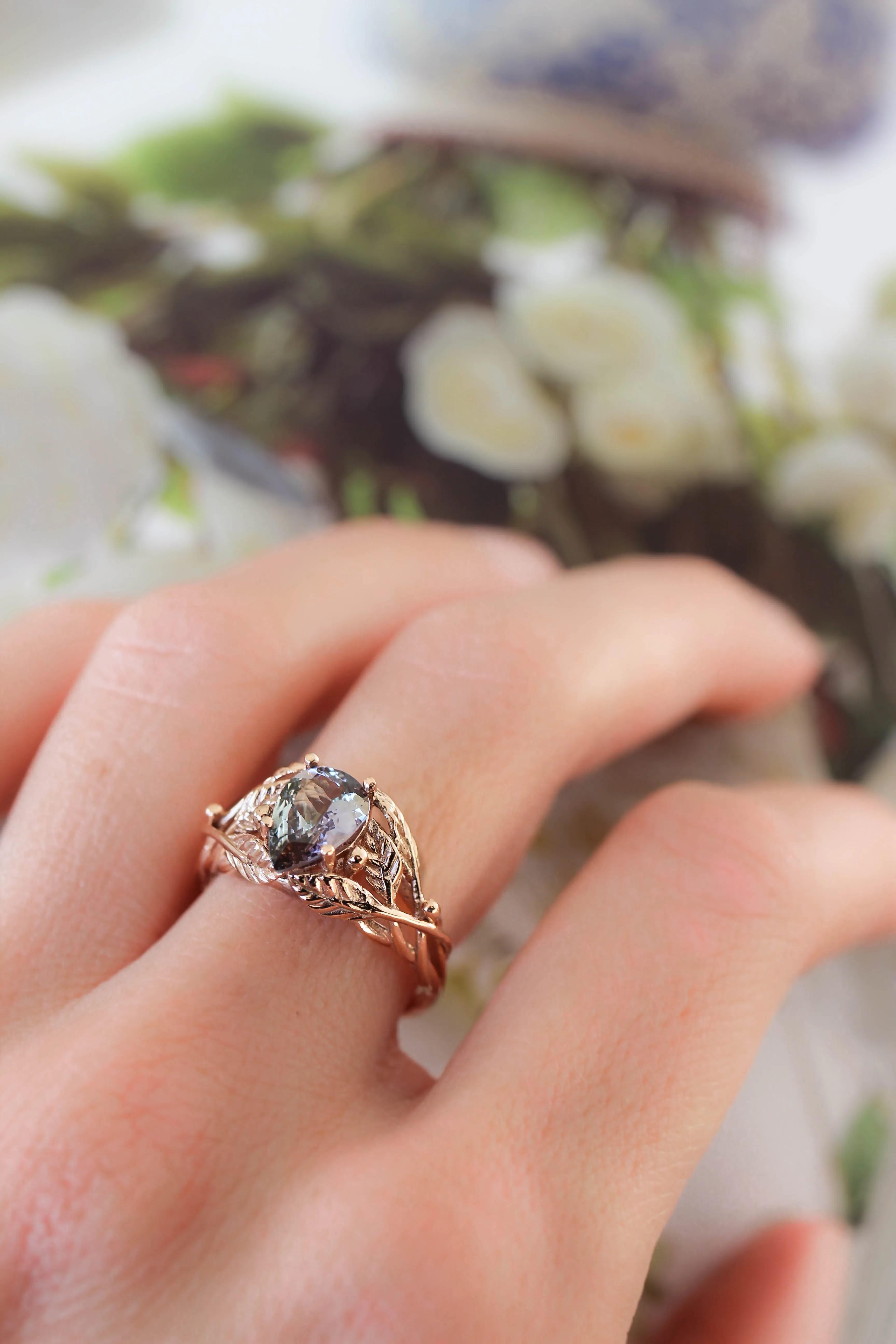 Tanzanite engagement ring, leaves ring with pear cut gemstone