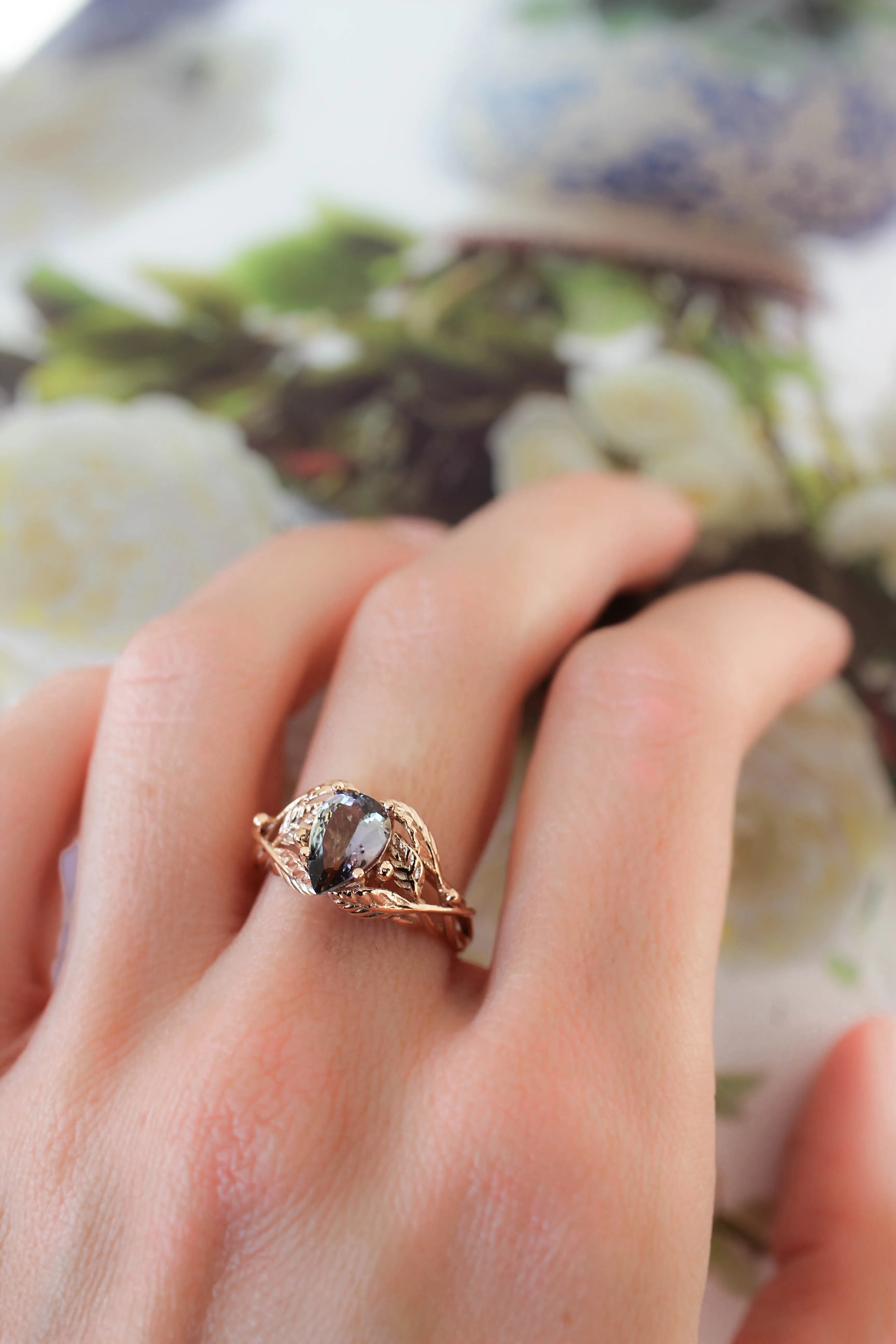 Tanzanite engagement ring, leaves ring with pear cut gemstone